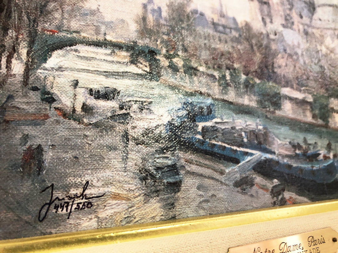 Thomas Kinkade painting of Notre Dame Cathedral in Paris with the River Seine and a flower-lined sidewalk.